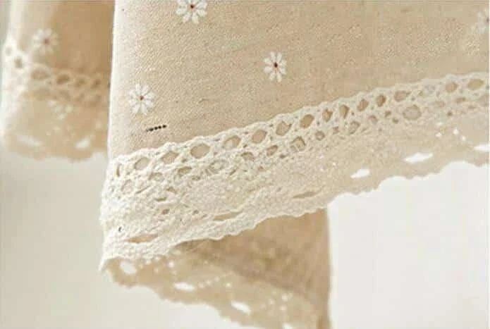 Elegant floral linen tablecloths in various sizes, perfect for dining and entertaining in the British style.