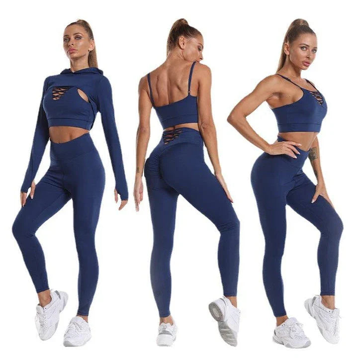 A 3-piece sports set including a hooded top, sports bra, and high-waisted leggings in a black colour scheme.