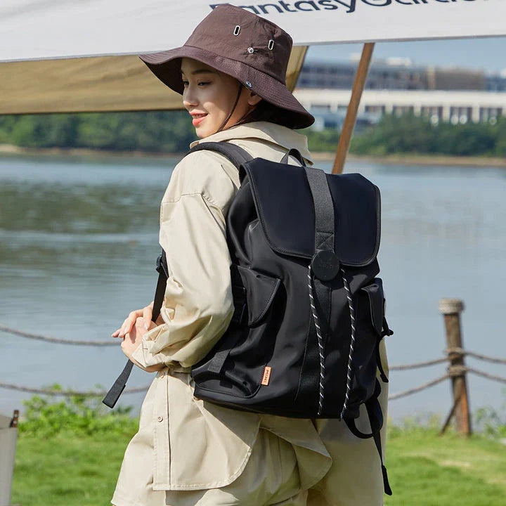 A stylish and versatile 16-inch laptop backpack with a padded compartment, water-repellent fabric, and breathable mesh design