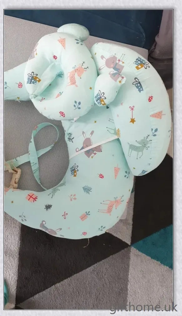 Premium breastfeeding nursing pillow with adjustable buckle, soft cotton fabric, and extra cushioning to support baby's head and prevent reflux.