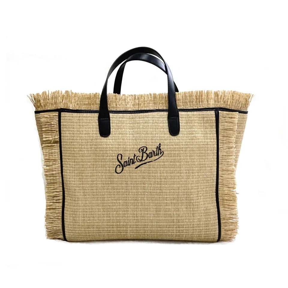 Stylish embroidered straw tote bag with playful tassels, perfect for summer outings and beach adventures.