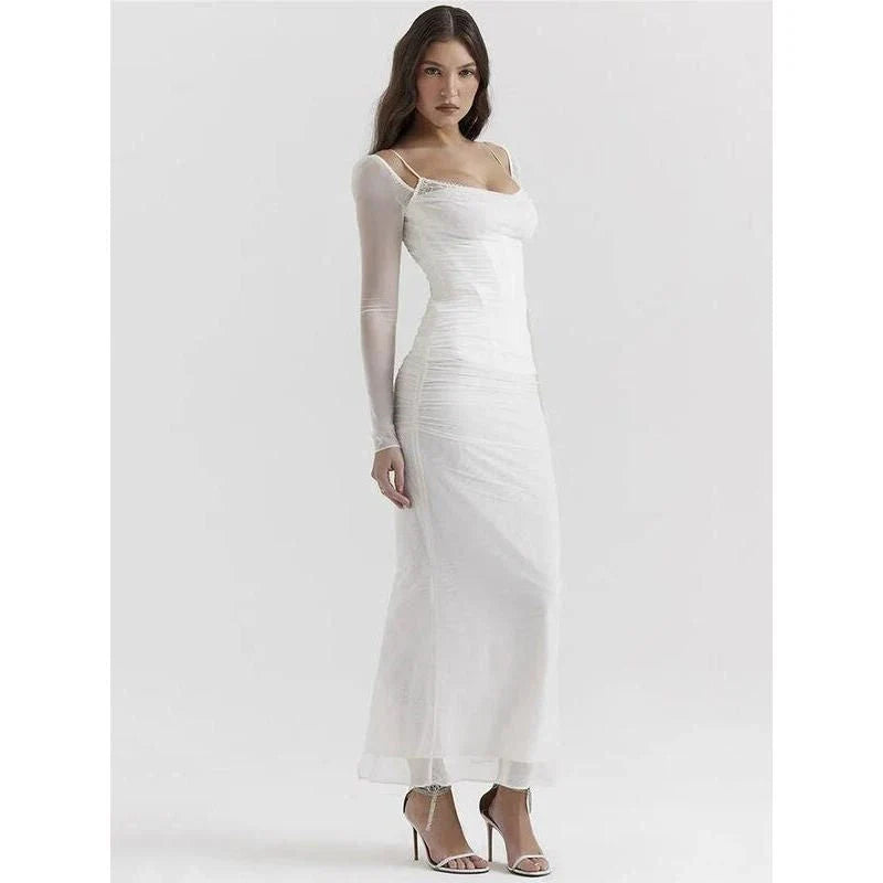 Elegant sheer long sleeve maxi dress in black, featuring a flattering H-profile silhouette and full-length design for a sophisticated evening look.