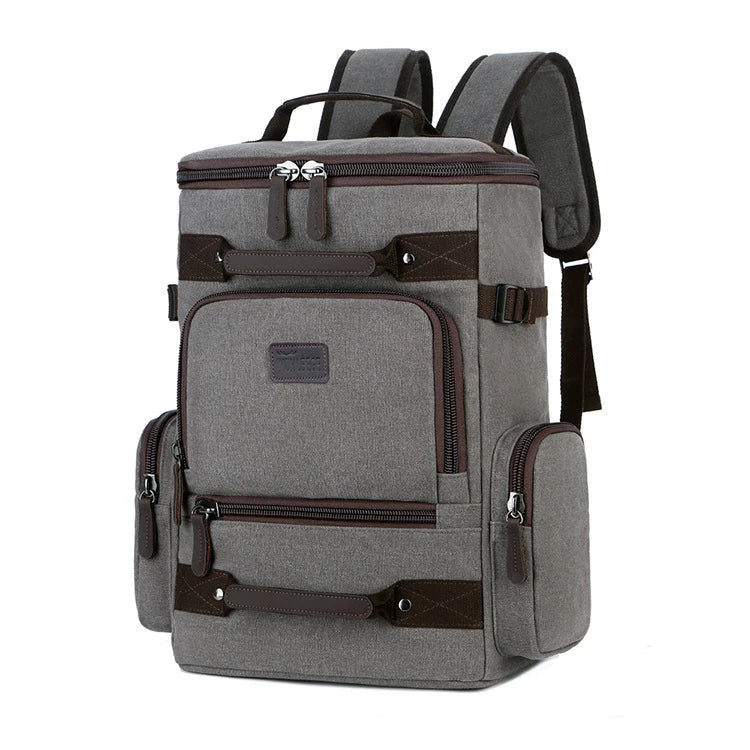 A classic messenger bag made of durable canvas with genuine leather trim, offering style and function for the modern British gentleman