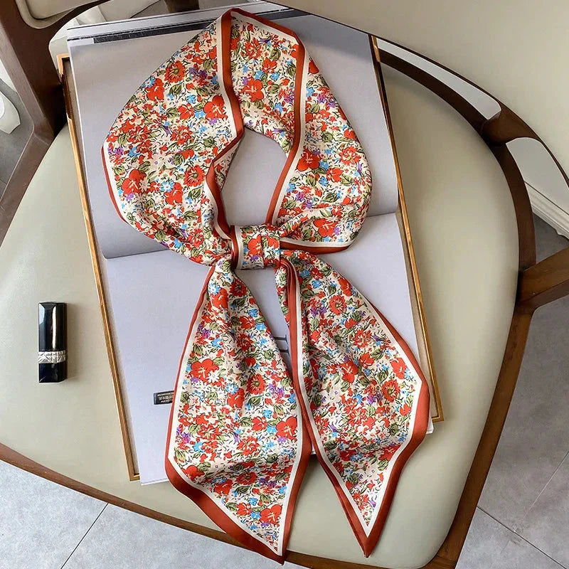 Elegant floral print polyester scarf with a soft, cotton-like texture for versatile seasonal wear