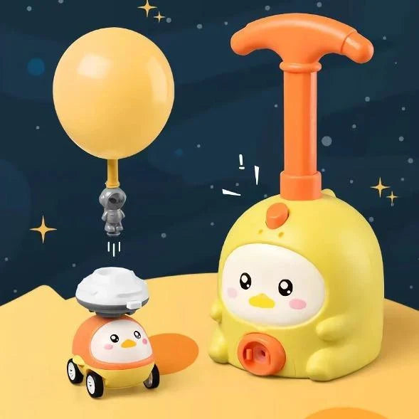 Balloon-powered launcher and car set for children, featuring a pink pig design and components for educational science play