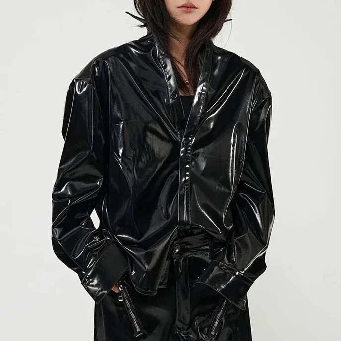 Elegant, fleece-lined PU leather jacket in a sleek, glossy black finish for timeless style and comfort