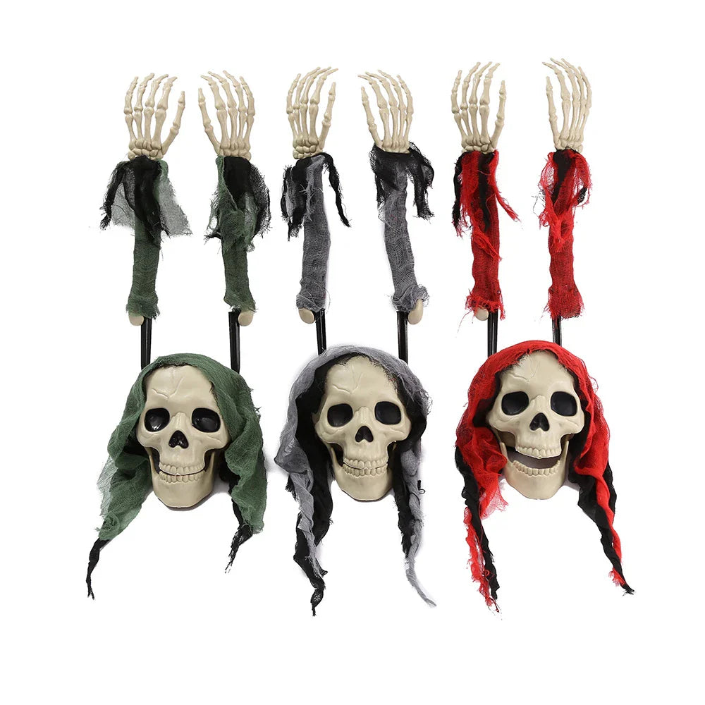 Three decorative plastic skull figures in green, red, and grey colours, perfect for Halloween home decor