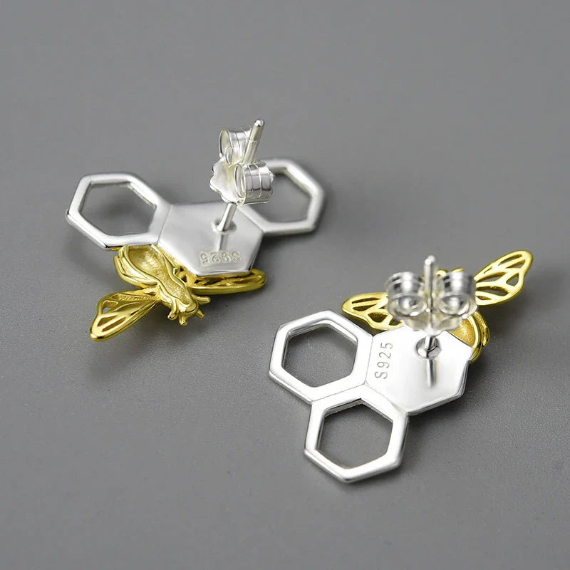 Elegant sterling silver beehive-inspired stud earrings with a nature-inspired design, perfect for fashion-conscious women