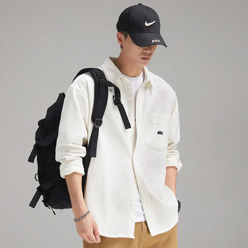 A relaxed, loose-fitting men's shirt in a retro-inspired design, crafted from premium cotton for exceptional comfort and style.