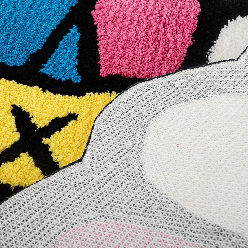 Cheerful smiling face tufted carpet in pink and blue colours, a plush and comfortable home decor item