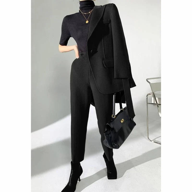 Elegant autumn-winter woollen pant suit with belted jacket and warm trousers for women