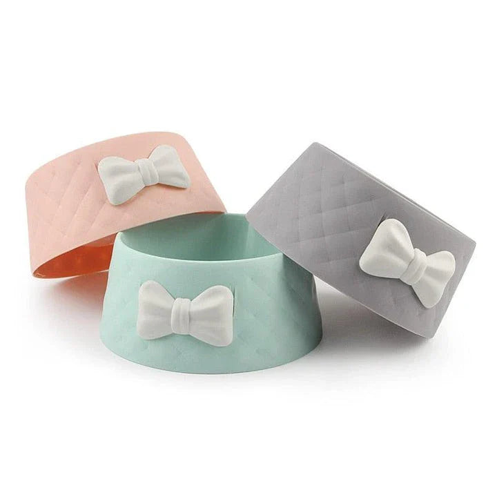 Stylish bowknot feeding bowl for pets, available in blue, grey, and pink colours