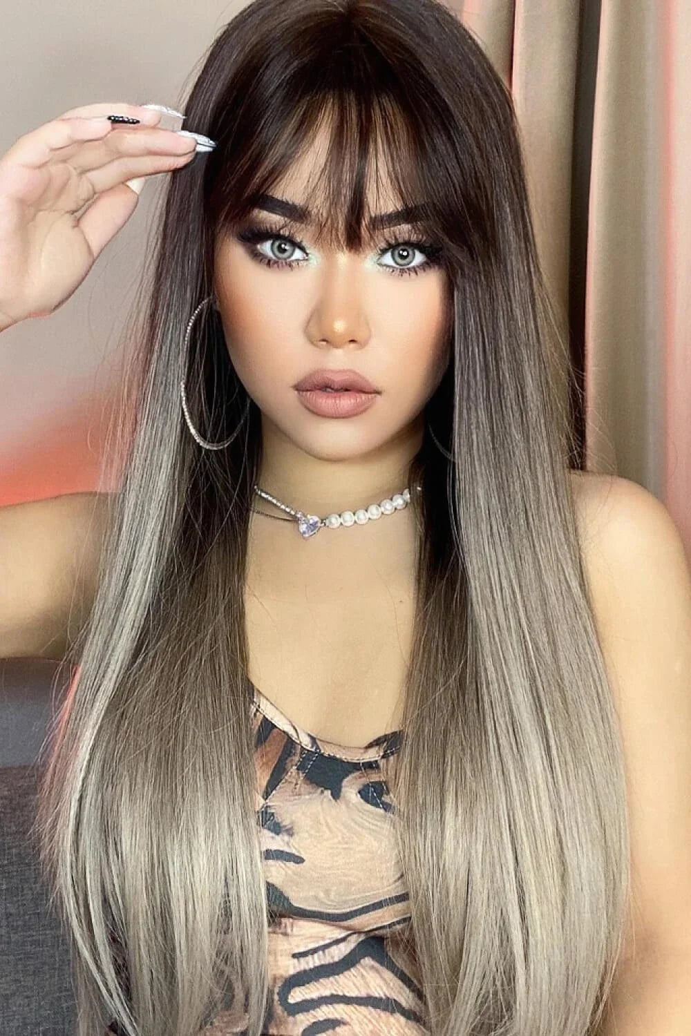 Stylish long straight synthetic wig with a comfortable cap and heat-safe design for versatile hair transformation