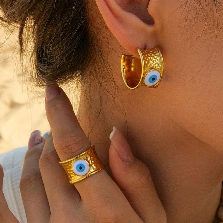 Luxury 18K gold-plated earrings with a unique Devil's Eye design and hammer grain texture in stainless steel