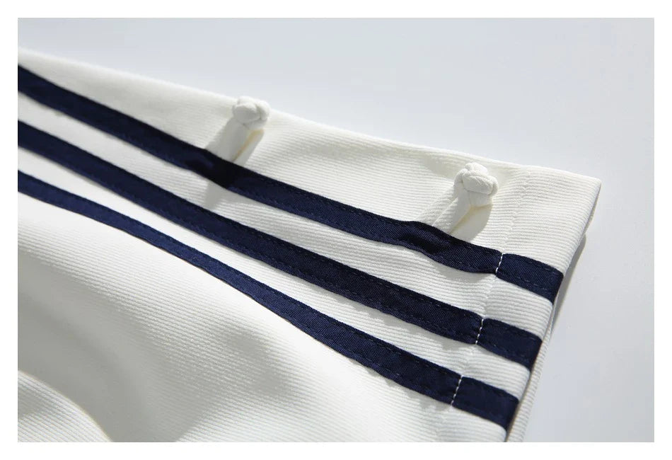 Stylish striped sports trousers in a relaxed, mid-waist design for versatile leisure and athletic wear
