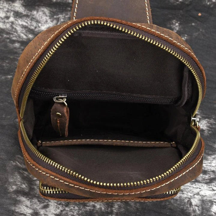 Vintage-inspired genuine leather briefcase with multiple compartments and secure zipper closure, ideal for modern commuters