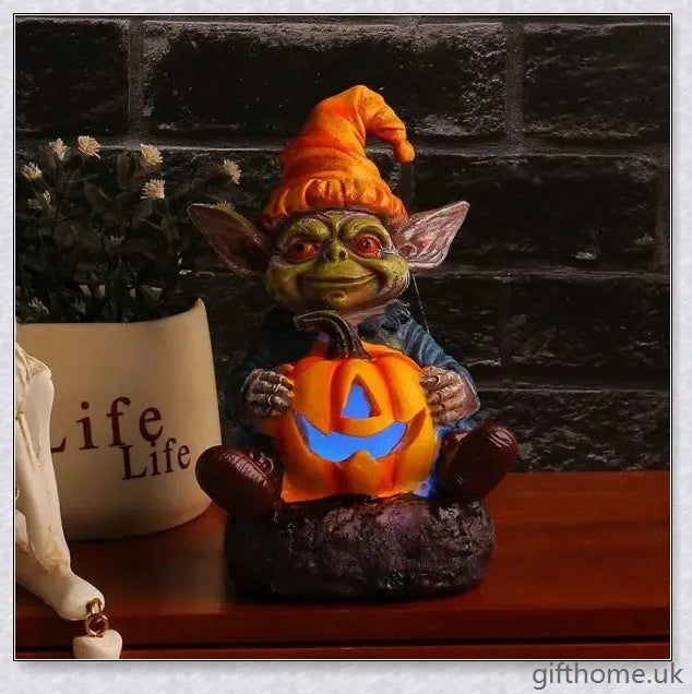Eerie Halloween Resin Figurine with Glowing Pumpkin Lamp, a spooky and enchanting décor piece for your holiday celebrations