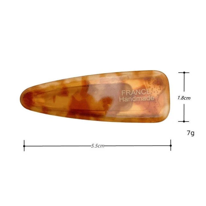 Two marble-patterned hair clips in a contemporary geometric design, made from high-quality acetate and acrylic materials.