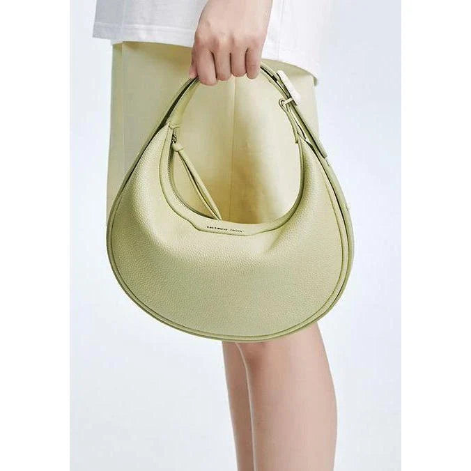Stylish crescent-shaped leather crossbody bag with soft, supple texture for everyday elegance