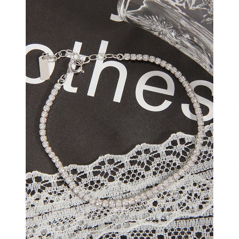 Sparkling silver geometric bracelet with adjustable clasp and intricate patterns