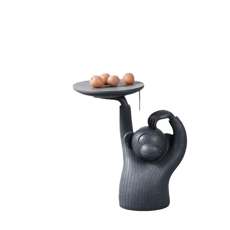Decorative monkey-inspired resin coffee table tray in light grey or dark grey colour, suitable for serving, display, or as a living room accent piece.