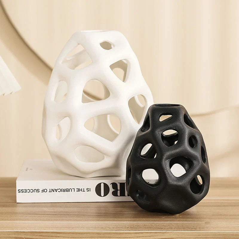 Stylish ceramic decorative balls in geometric design, available in white and black, small and large sizes, for modern home decor