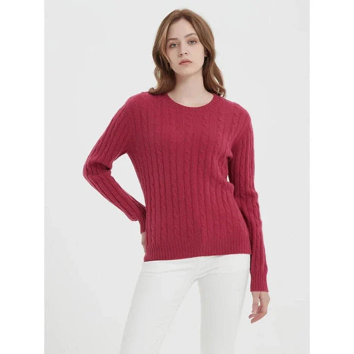 A luxurious 100% British wool cable knit jumper in a rich camel colour, perfect for keeping warm during the UK's chilly winters.