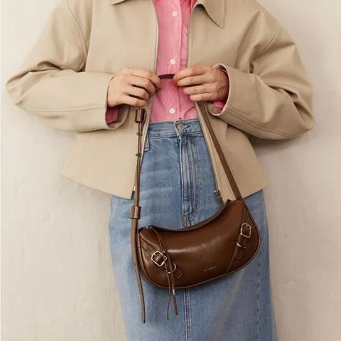 Elegant black shoulder and crossbody baguette bag made with premium split leather and synthetic lining