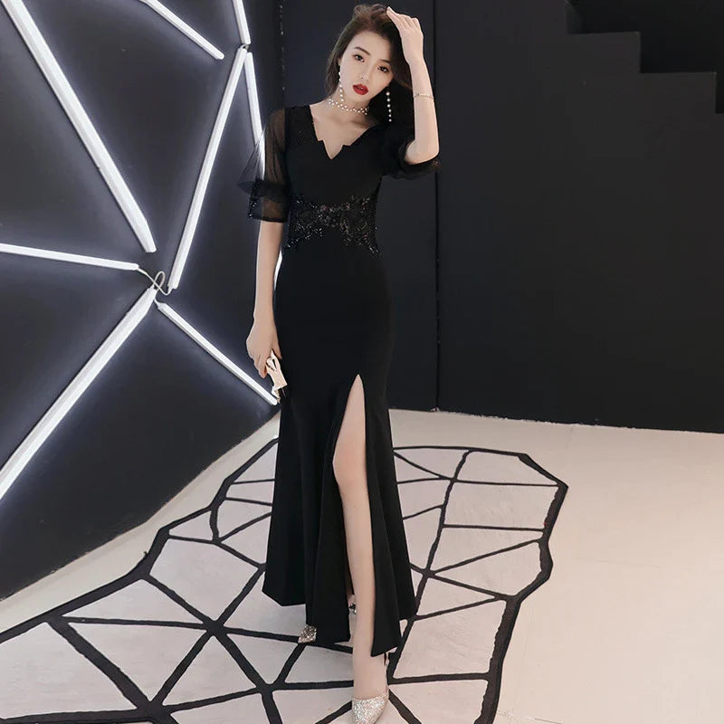 Elegant black evening dress with middle-length sleeves, perfect for formal occasions in the UK