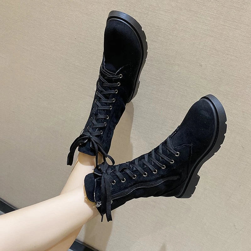 A pair of stylish British retro boots with a durable rubber sole and a cloth upper, perfect for fashionable female students.