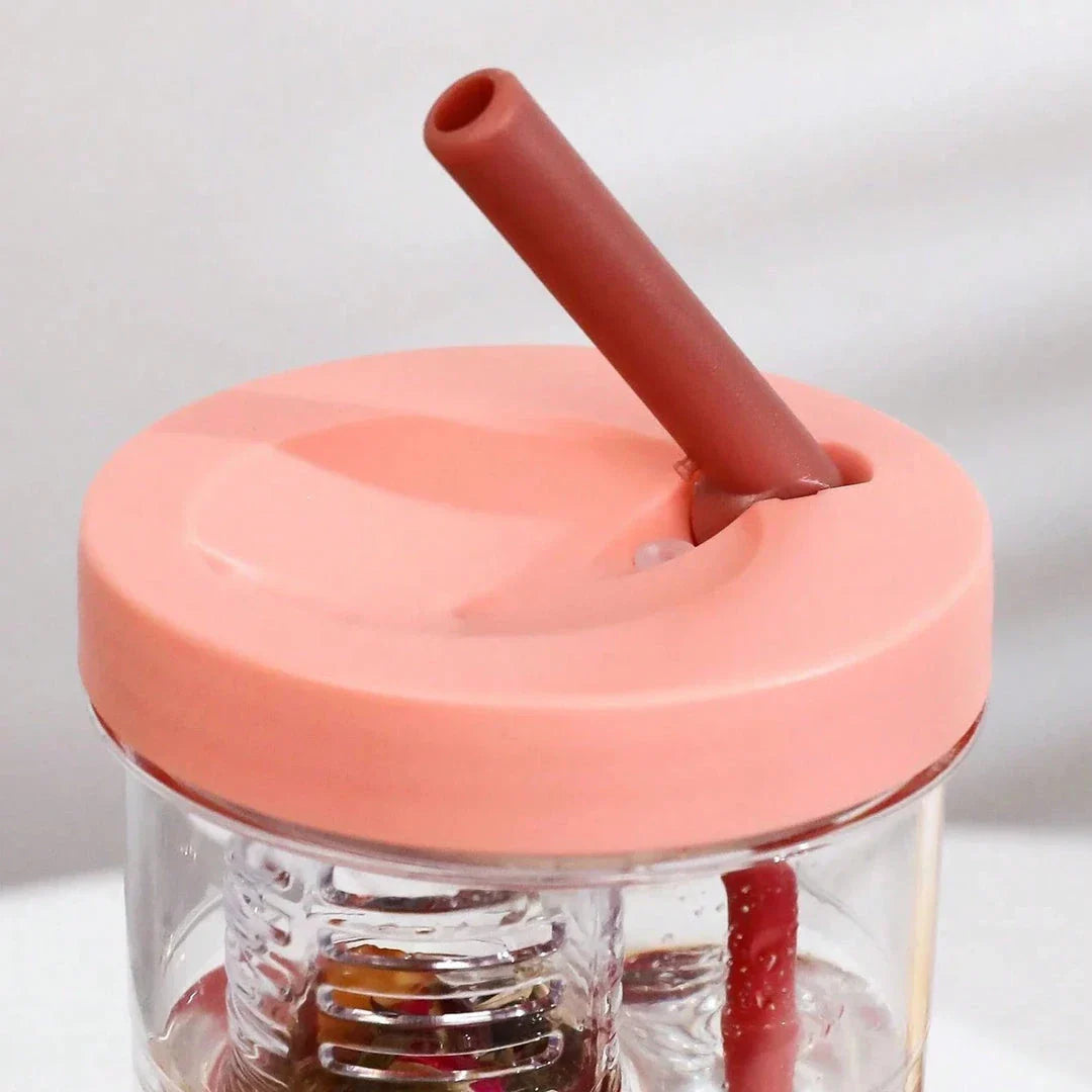 A transparent 700ml drinking bottle with a straw and built-in lemon filter, perfect for staying hydrated on the go.