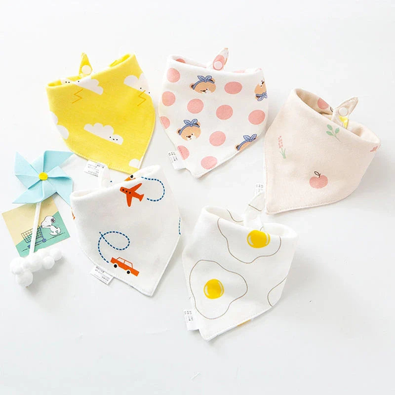 Stylish cotton baby bandana bibs in various fashionable prints, designed to keep your little one dry and comfortable.