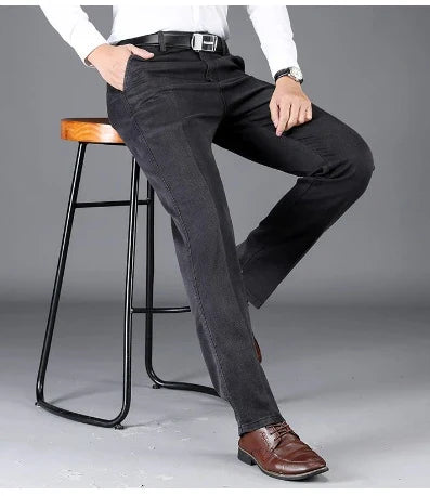 Black washed pleated trousers with oversized pockets and a micro-flared leg design for casual comfort and style