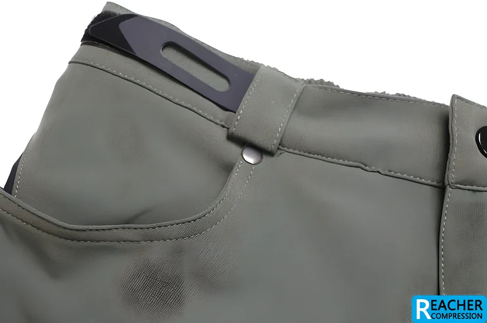 Men's cycling shorts in black and green colours, with adjustable waistband and zipper pockets for storage