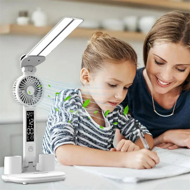 Foldable LED desk lamp with fan, thermometer, and pen holder on a tidy desk