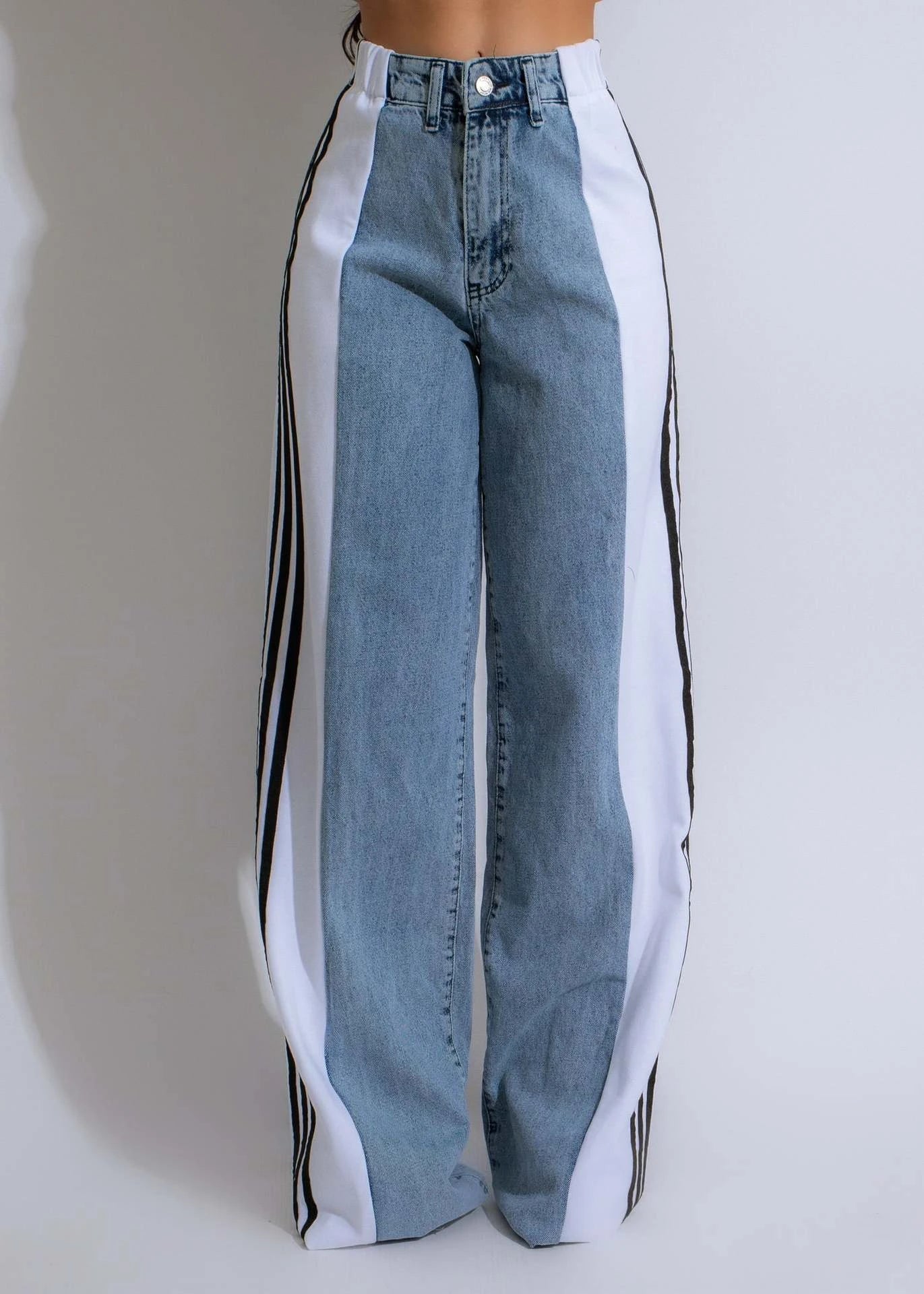 Stylish high-waist denim pants with patchwork details, available in a range of trendy color combinations