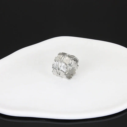 Adjustable stainless steel finger ring with unique charm designs