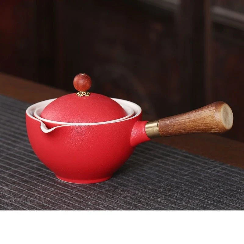 Handcrafted ceramic teapot with wooden handle, designed for brewing traditional Oolong tea with enhanced flavour and aroma