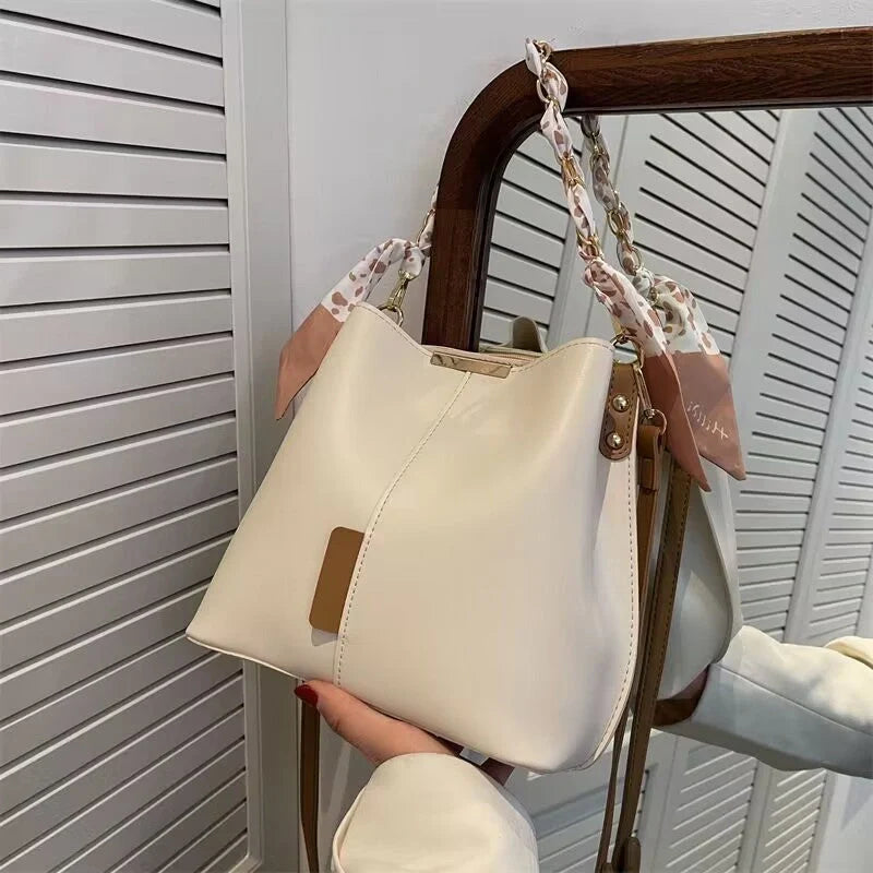 Women's PU bucket bag in white, army green, and light brown with adjustable shoulder strap