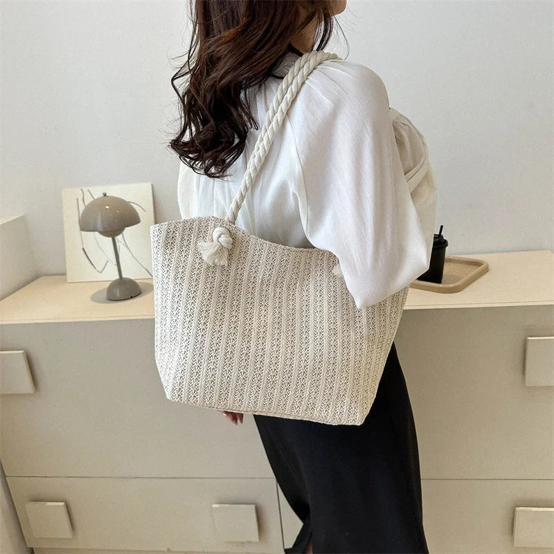 Stylish women's straw shoulder tote bag with large capacity, perfect for summer and everyday use.