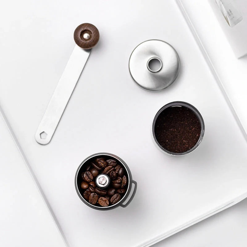 Portable hand coffee machine with stainless steel grinder and folding handle