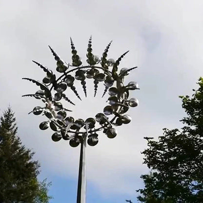 Elegant revolving metal windmill outdoor ornament with dual-layered blades creating a mesmerizing display in the garden