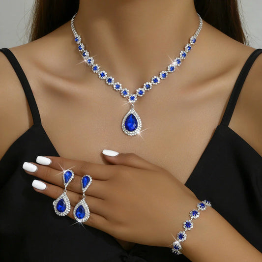 Elegant rhinestone jewelry set with necklace, earrings, and bracelet in a celestial-inspired design
