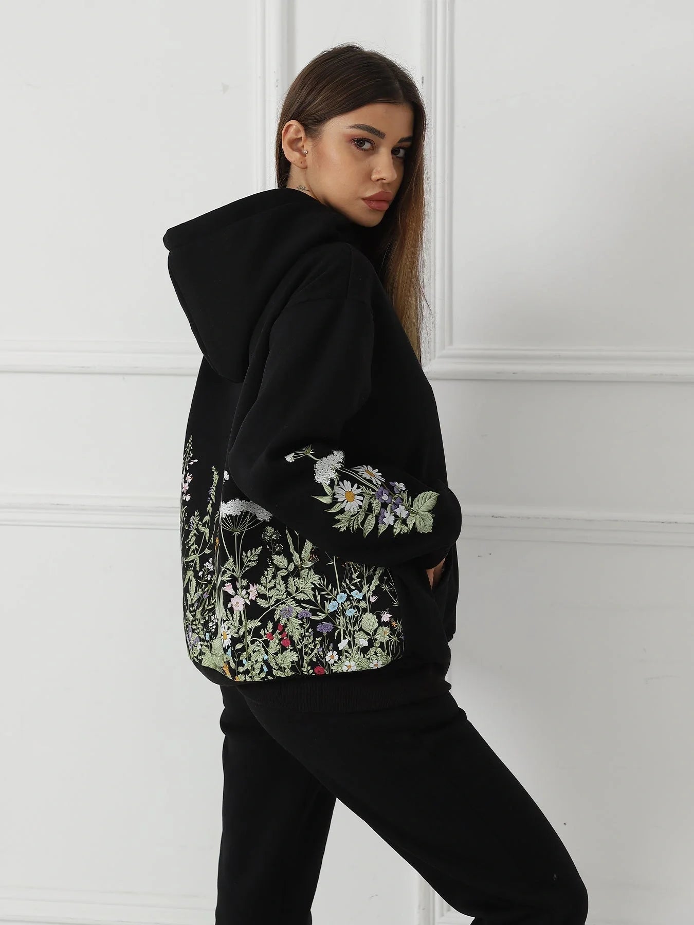 Women's floral long sleeved sweatshirt in black, blue, and apricot