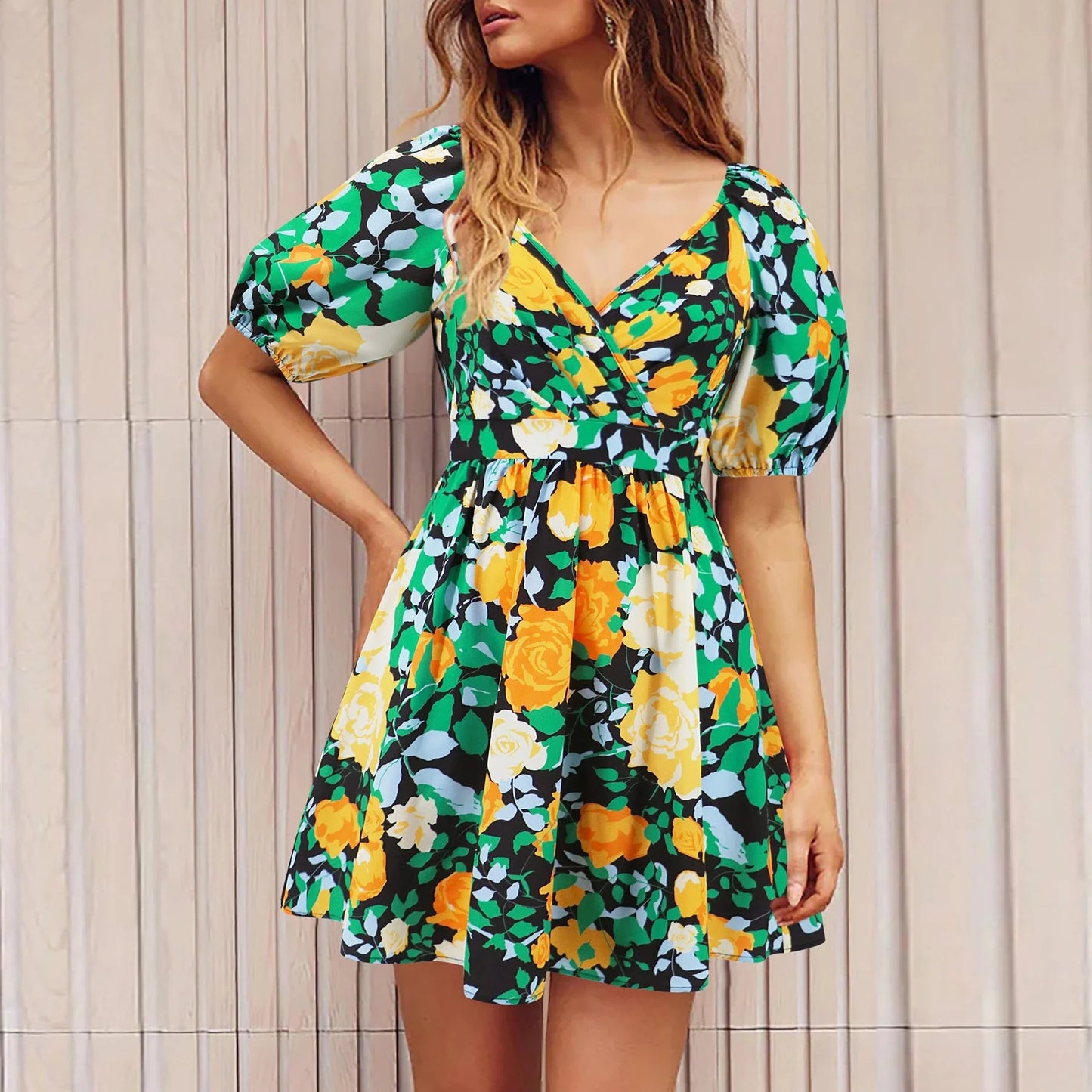 Stylish floral dress with V-neck and lantern sleeves, perfect for summer vacations and warm-weather occasions