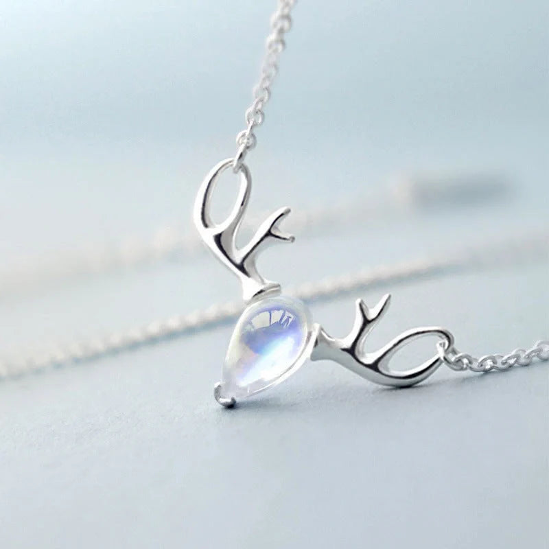 Elegant silver-toned elk necklace with a captivating moonstone pendant, a stunning Korean-inspired jewellery piece
