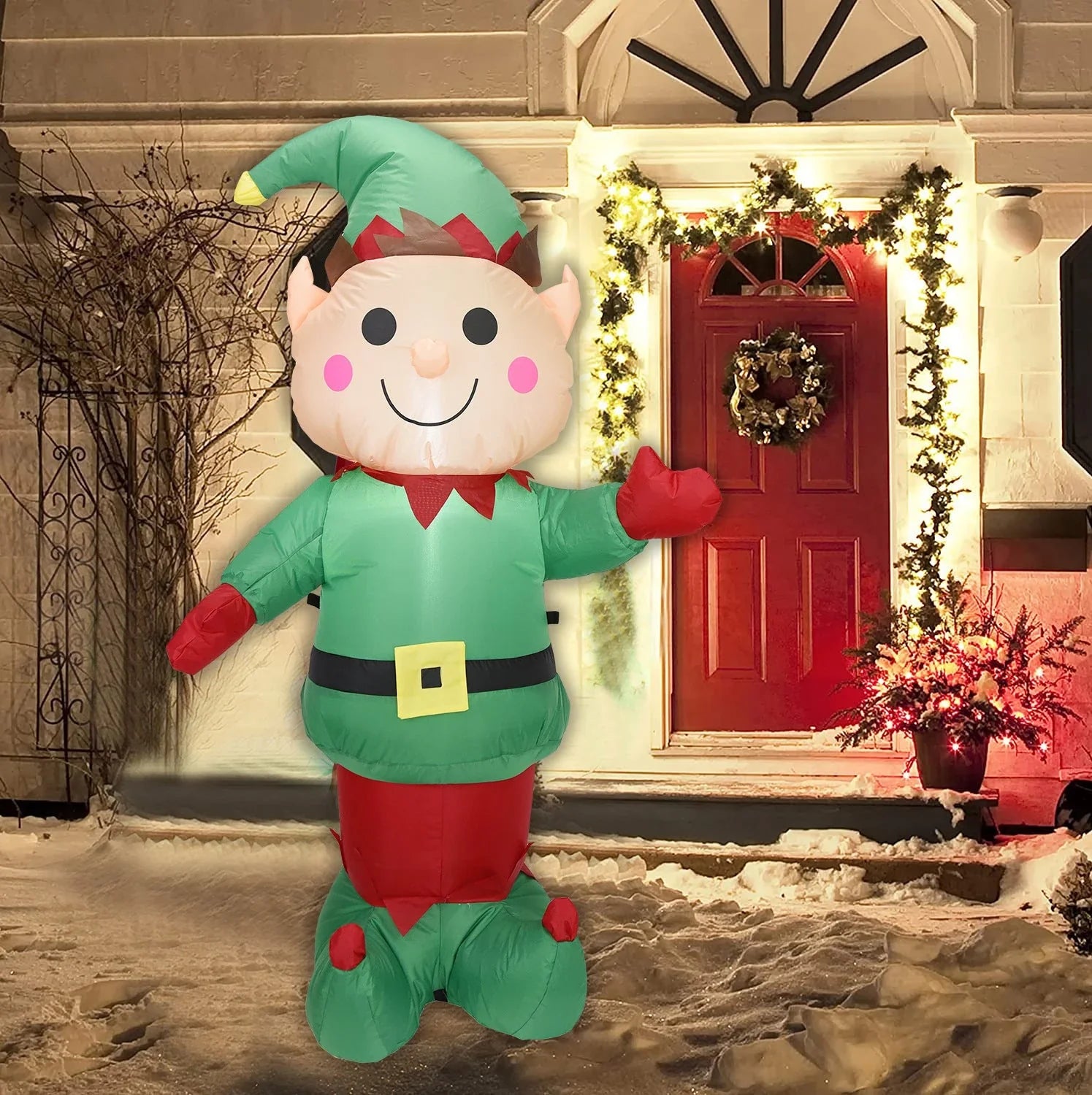 Inflatable Christmas bear decoration with LED lights, sand bag, and ground stakes for secure outdoor display