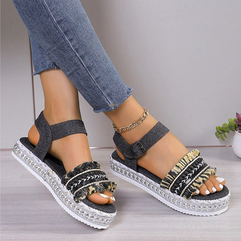 Stylish denim tassel sandals for women with thick flat sole, perfect for summer.