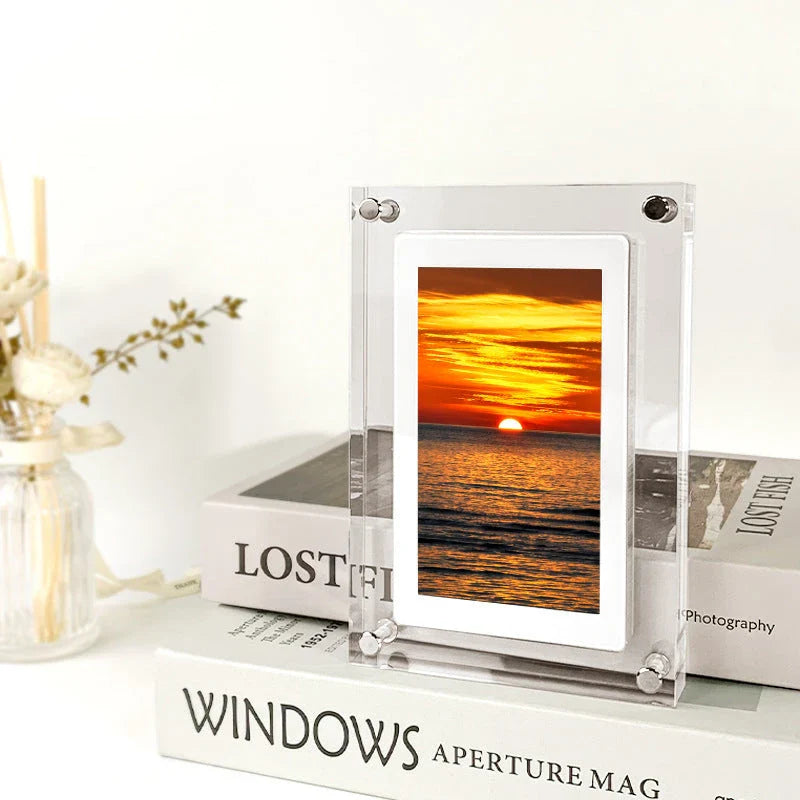 Stylish digital picture frame with acrylic exterior, supporting full HD video playback, automatic content recognition, and dual-speaker audio system