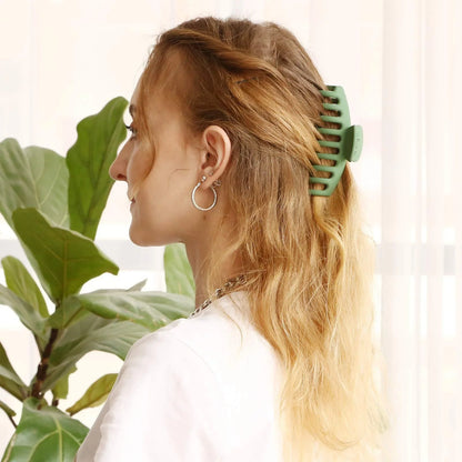 Candy-coloured plastic ponytail clip for showers and daily hair styling